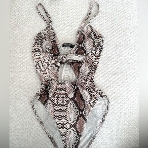 Snakeskin print body suit
